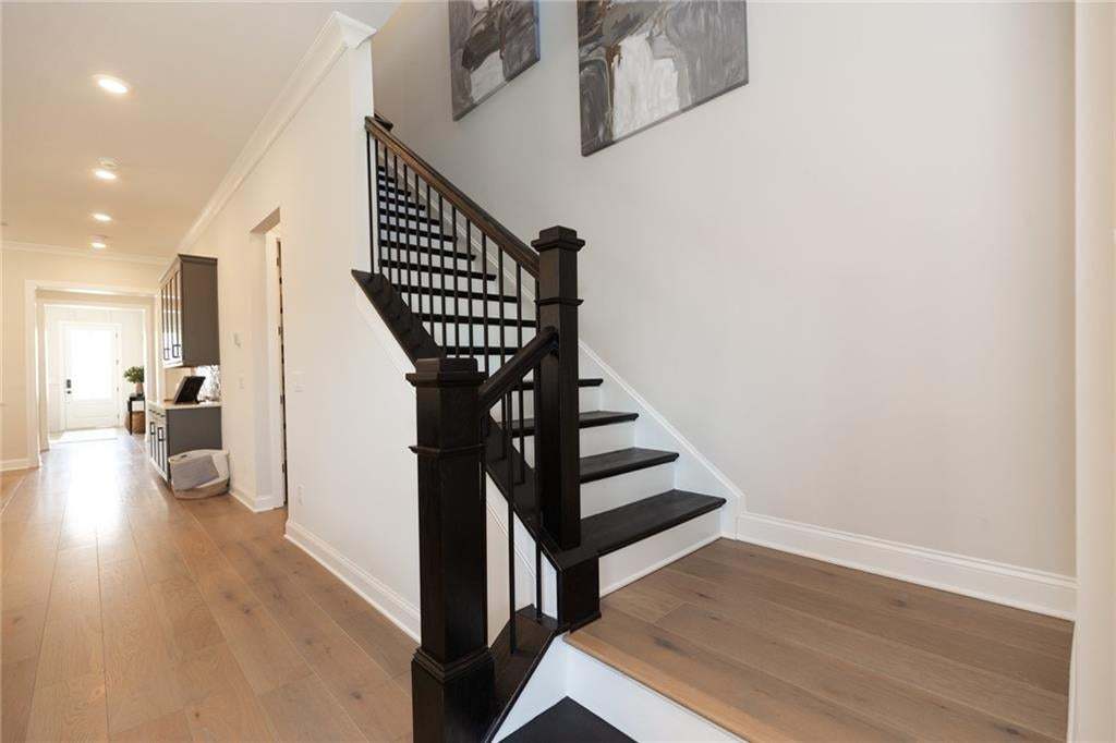 Detailing is in the design...beautiful hardwoods leading to second floor.  Photo not of actual home but a previously built Madilyn by The Providence Group.