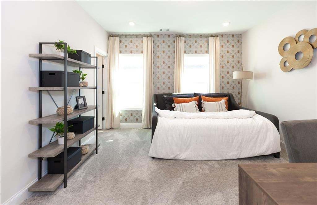 Such a spacious secondary bedroom located on second floor of the Madilyn home.  Photo not of actual home but a previously built Madilyn by The Providence Group.