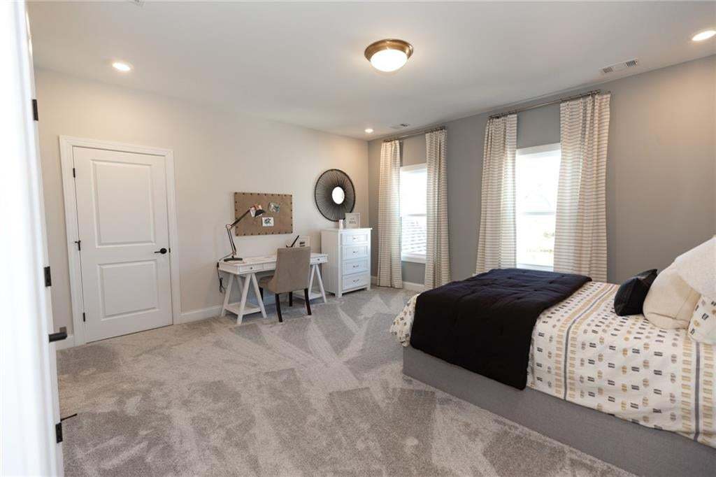 Another great sized bedroom located on second floor!! You are going to love this home..IT's a must see!  Photo not of actual home but a previously built Madilyn by The Providence Group.