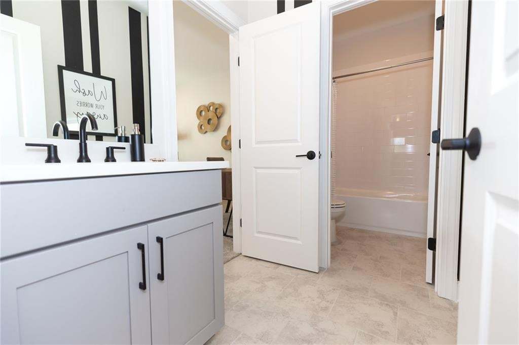 Great bathroom with accessibility from hallway and one of the bedrooms.  Photo not of actual home but a previously built Madilyn by The Providence Group.