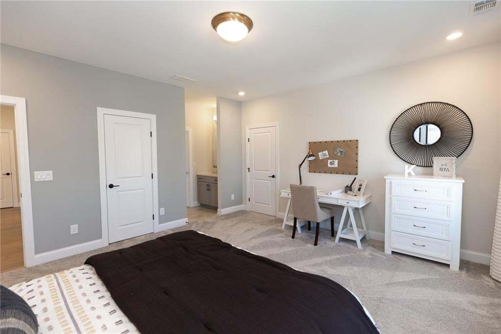 Secondary bedroom will have access to the separate vanity in bathroom.  Photo not of actual home but a previously built Madilyn by The Providence Group.