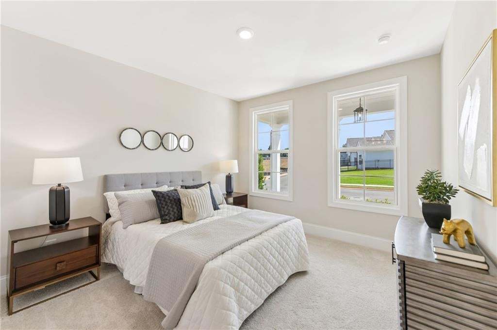 Primary bedroom located on first floor, for easy living. Photo not of actual home but a previously built TPG home.