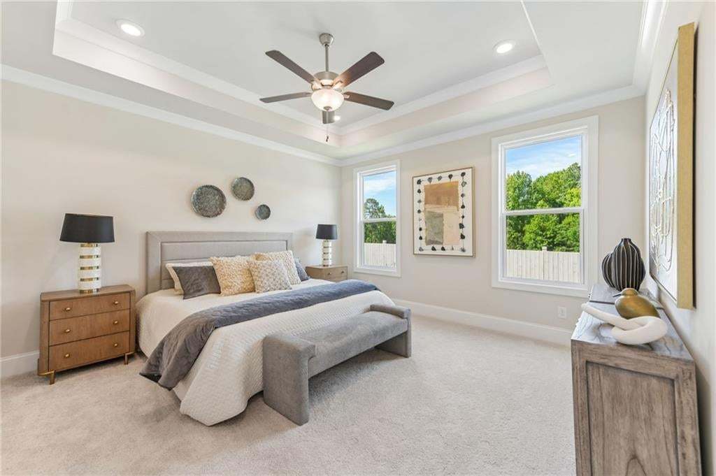 Primary bedroom has ample space for your oversized furniture. Photo not of actual home but a previously built TPG home.