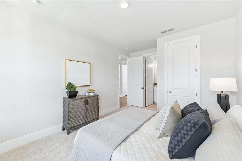 Secondary bedroom with ensuite.  Photo not of actual home but a previously built TPG home.