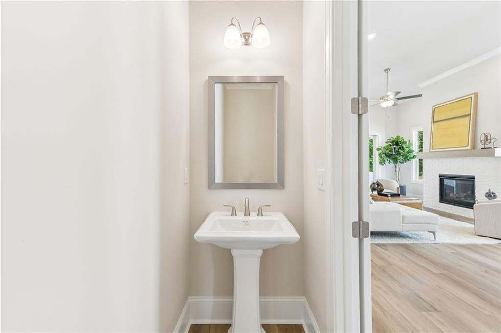 Conveniently located powder room. This is a 3 bedroom 3.5 bath home, the Braydon. Photo not of actual home but a previously built TPG home.