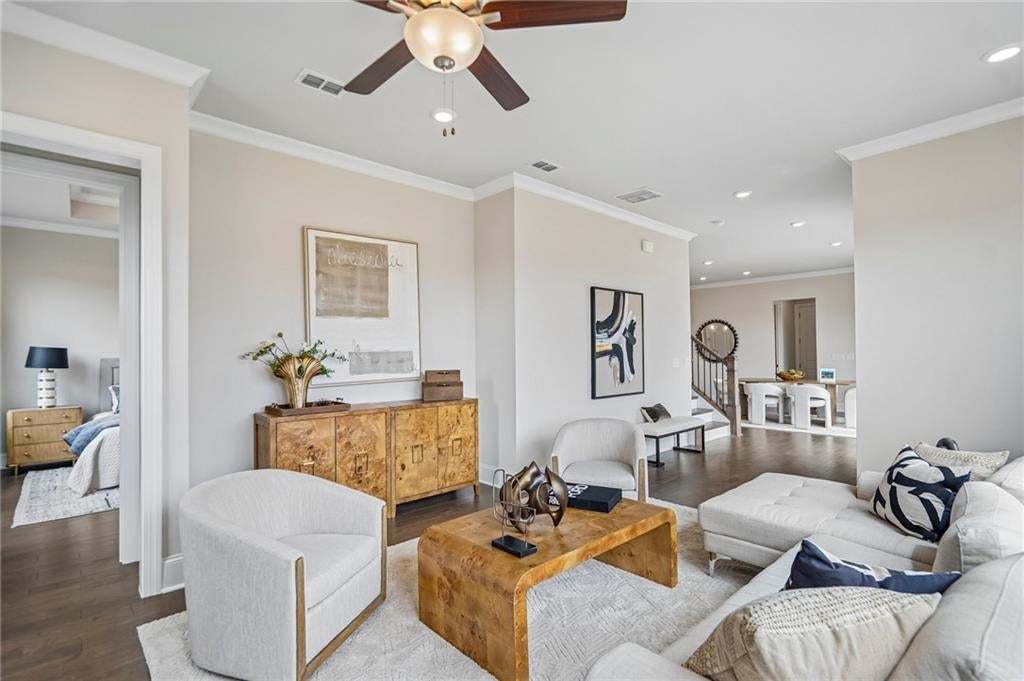 The family room is open concept but the kitchen is tucked backed- giving the family room time to shine