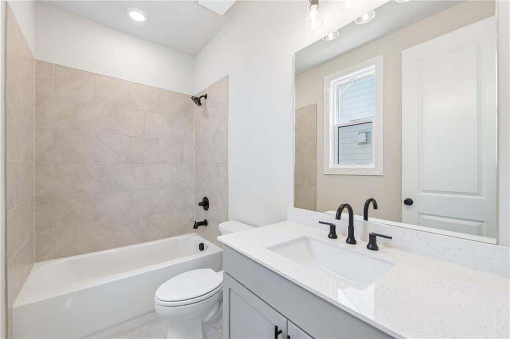 Recessed lighting and a single window provide illumination