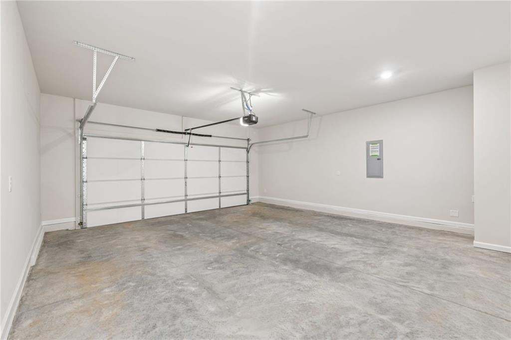 Spacious garage with garage door opener included