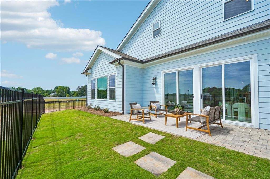 Fenced yards are a standard with our Villas at Aberdeen collection. Not of actual house but for representation purposes, previously built TPG home.