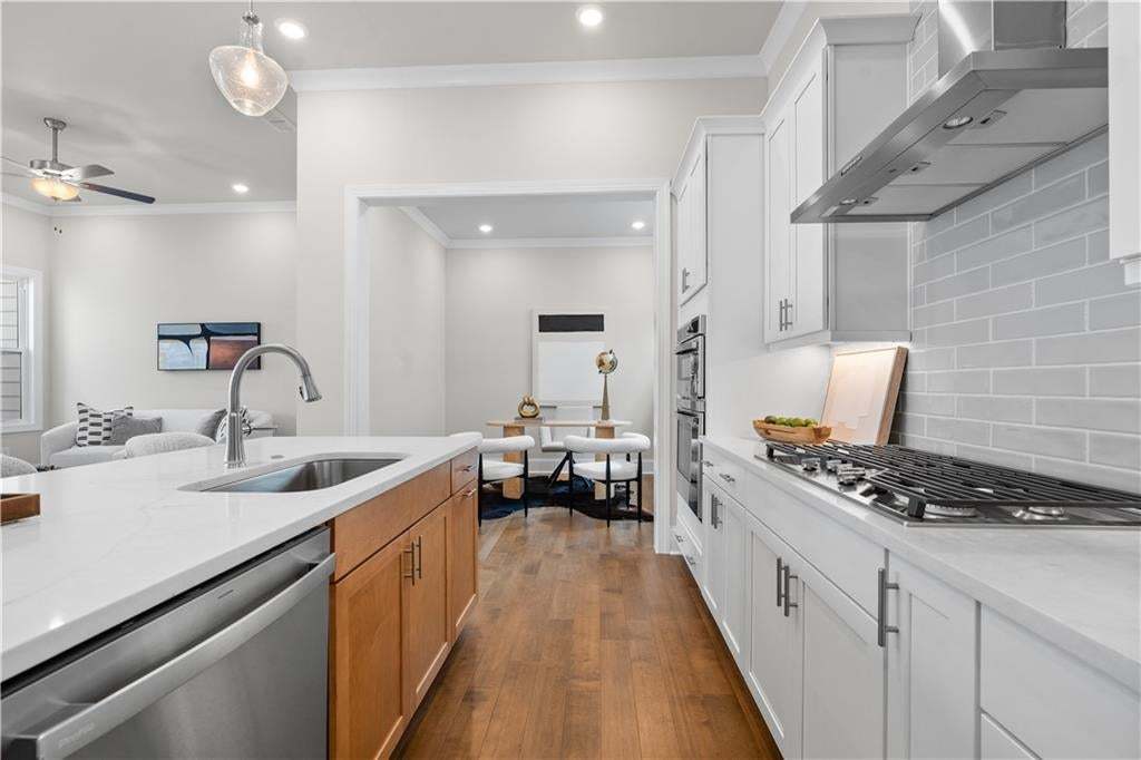 The flex space off of the kitchen is the perfect lil nook for a home office, informal dining, a library, whatever you need! Photo not of actual home but a similar TPG previously built home.
