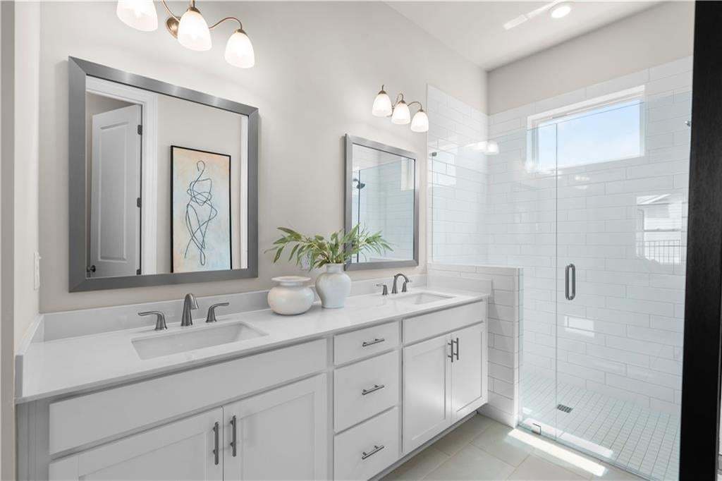 Primary bathroom is the perfect size in this 2 bedroom 2.5 bathroom ranch home. The Lily Photo not of actual home but a similar TPG previously built home.
