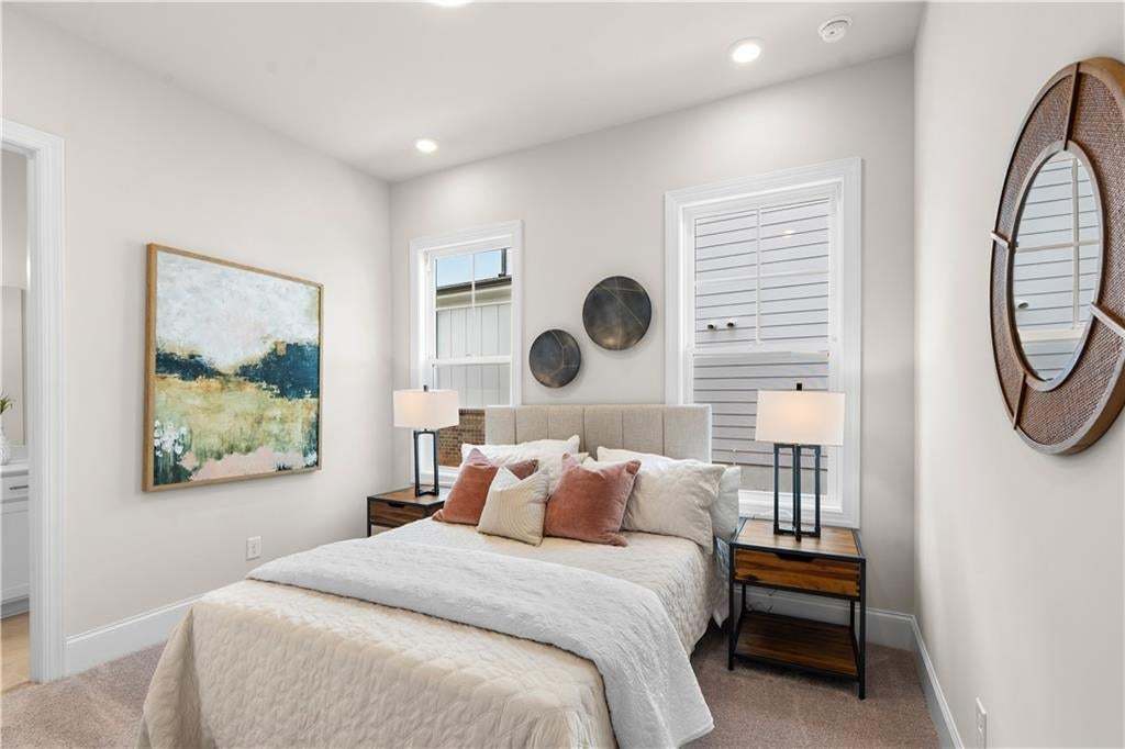 The secondary bedroom has it's own ensuite located on the main floor.  The Lily is truly a sweet gem! Photo not of actual home but a similar TPG previously built home.