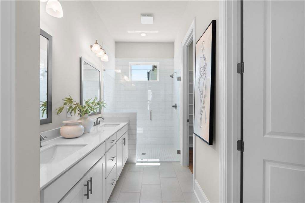 Love the space in this primary bathroom.  Zero entry shower.  Photo not of actual home but a similar TPG previously built home.