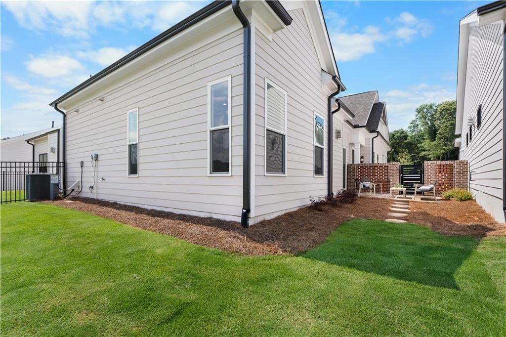 You have a courtyard for privacy and a backyard for entertaining!! Perfect!! Photo not of actual home but a similar TPG previously built home.