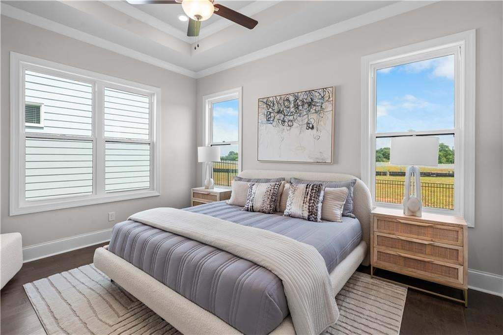 Love this primary bedroom located on main floor!  So much light to enjoy! Photo not of actual home but a similar TPG previously built home.