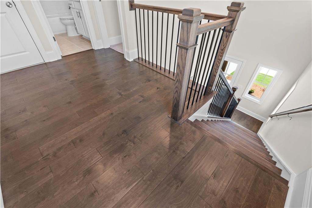 Landing to the two spacious secondary bedrooms located upstairs in the Orchid. Photo not of actual home but a similar TPG previously built home.