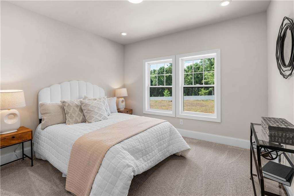 Secondary bedroom located upstairs in the Orchid..a 3-bedroom 2.5-bathroom home under construction in the Villas at Aberdeen community in Hoschton. Photo not of actual home but a similar TPG previously built home.