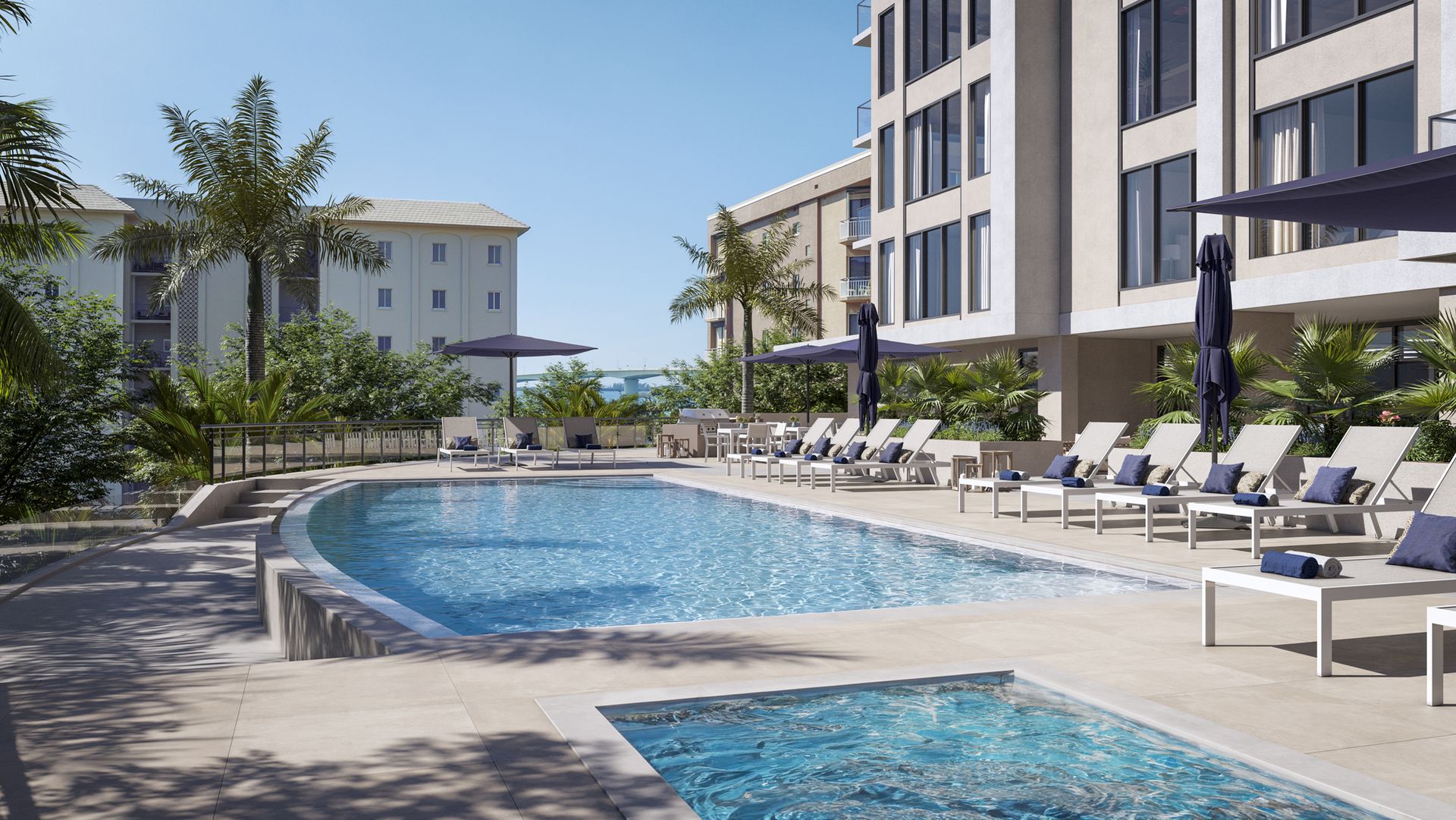 Infinity edge saltwater pool with lounge chairs and separate hot tub
