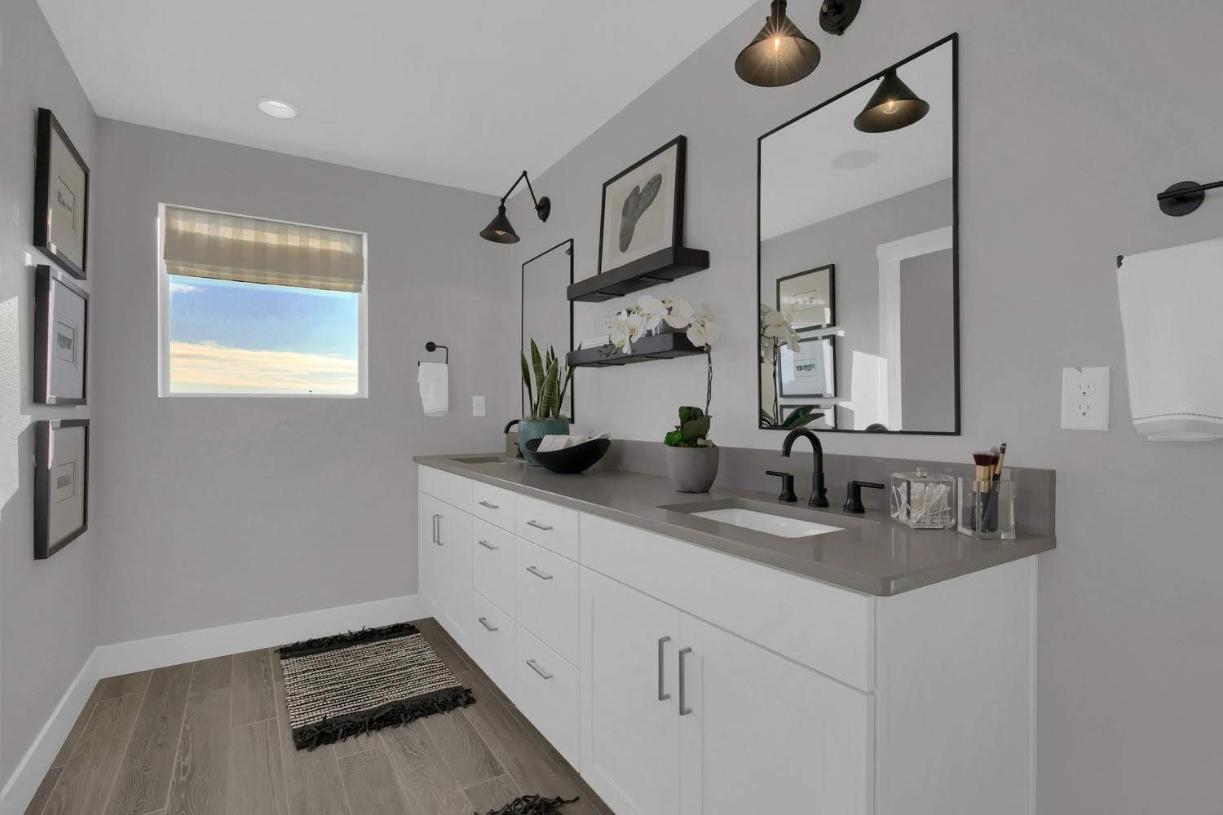 Getting ready for the day is easy with the primary bathroom dual sink vanity