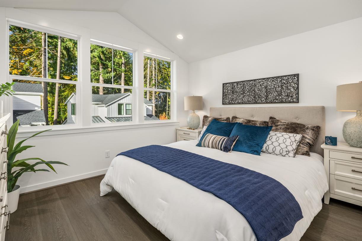 Primary bedroom suite with vaulted ceiling