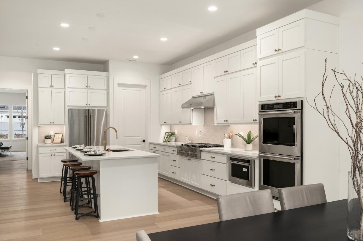 Spacious kitchen offers a large center island with breakfast bar seating