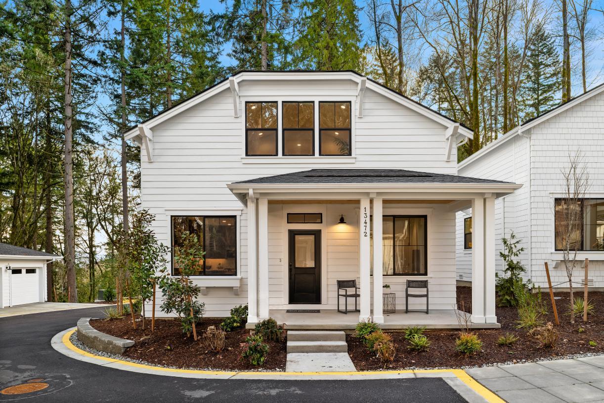 Lovely cottage architecture with a covered front porch