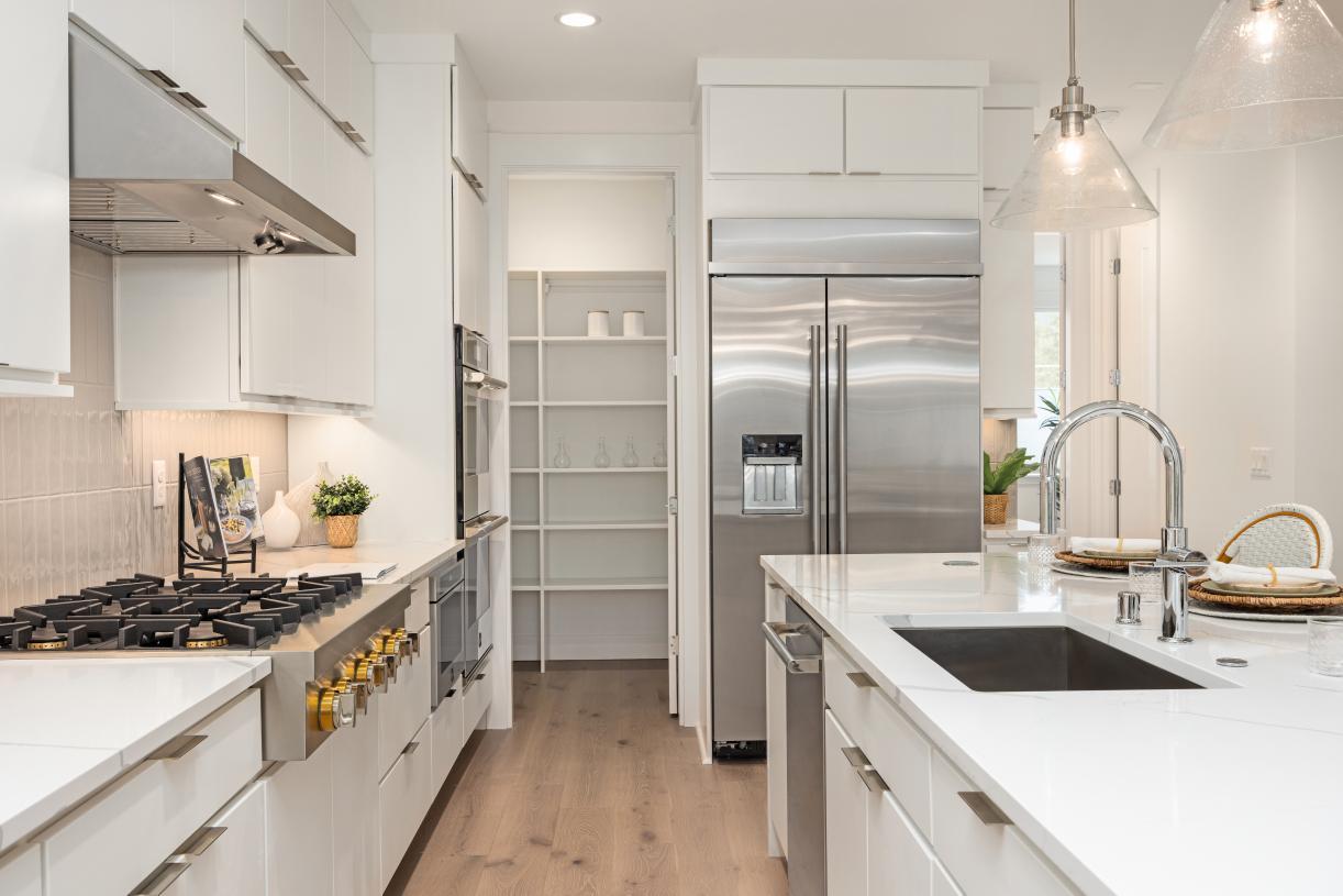 Well-designed kitchen with plenty of cabinet storage plus a walk-in pantry
