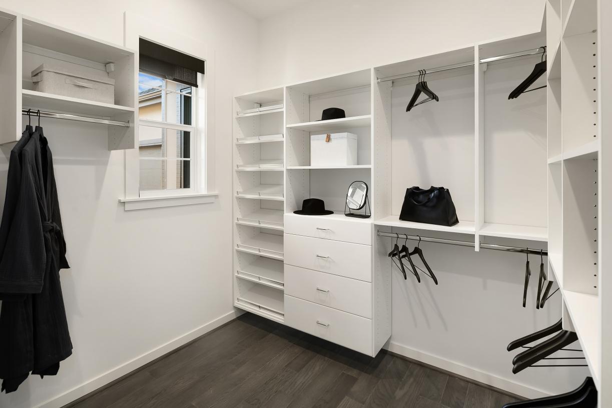 Primary suite offers a built-in closet system