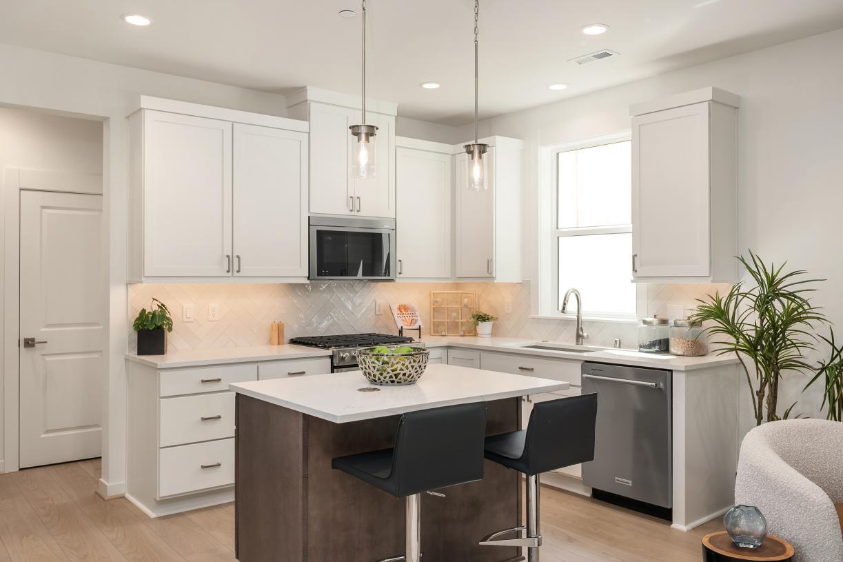 Kitchen features white shaker cabinets