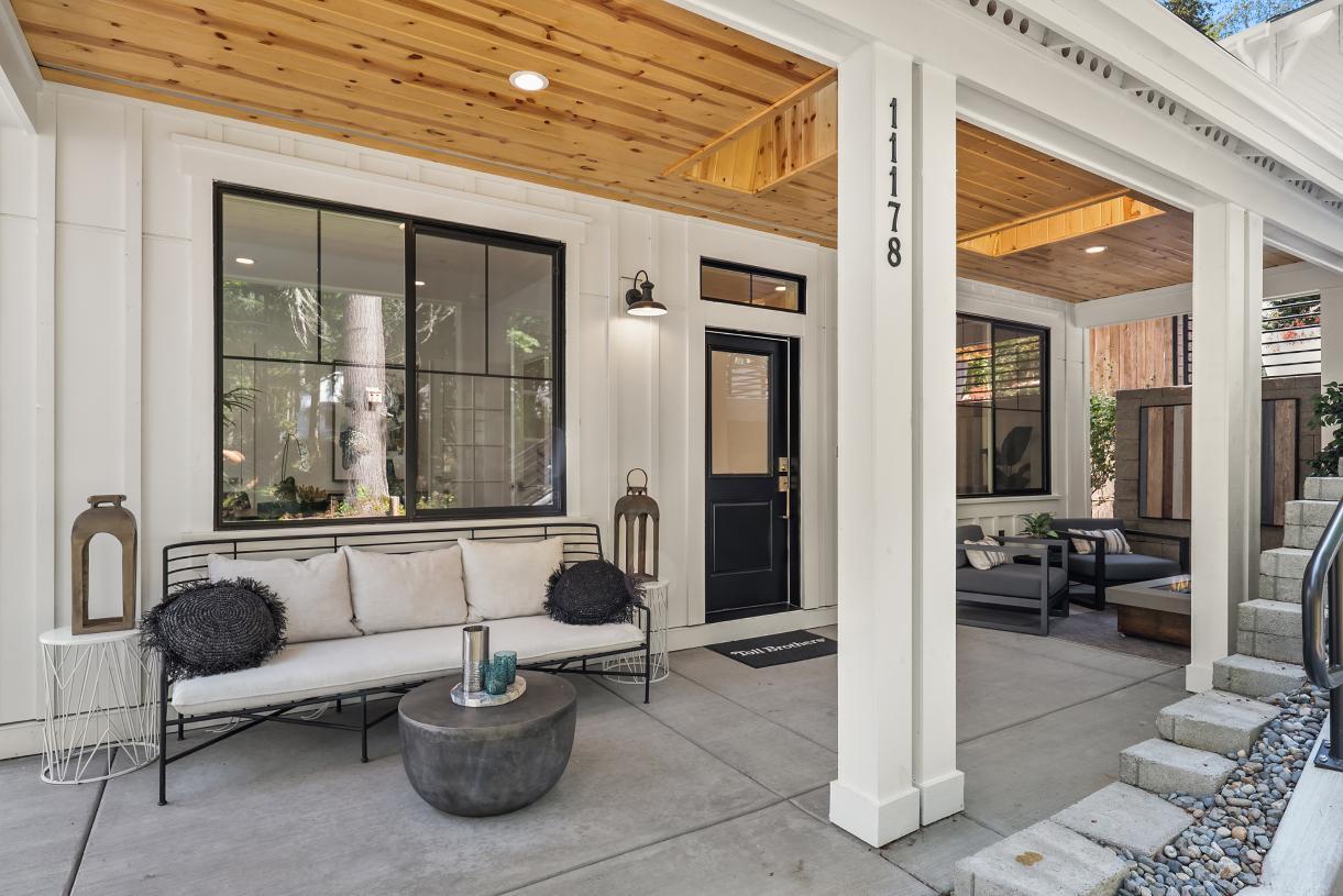 Covered patio offers 2 sitting areas