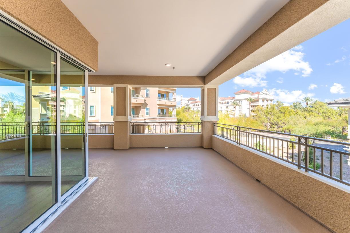 Large corner sliding doors open to a wraparound veranda