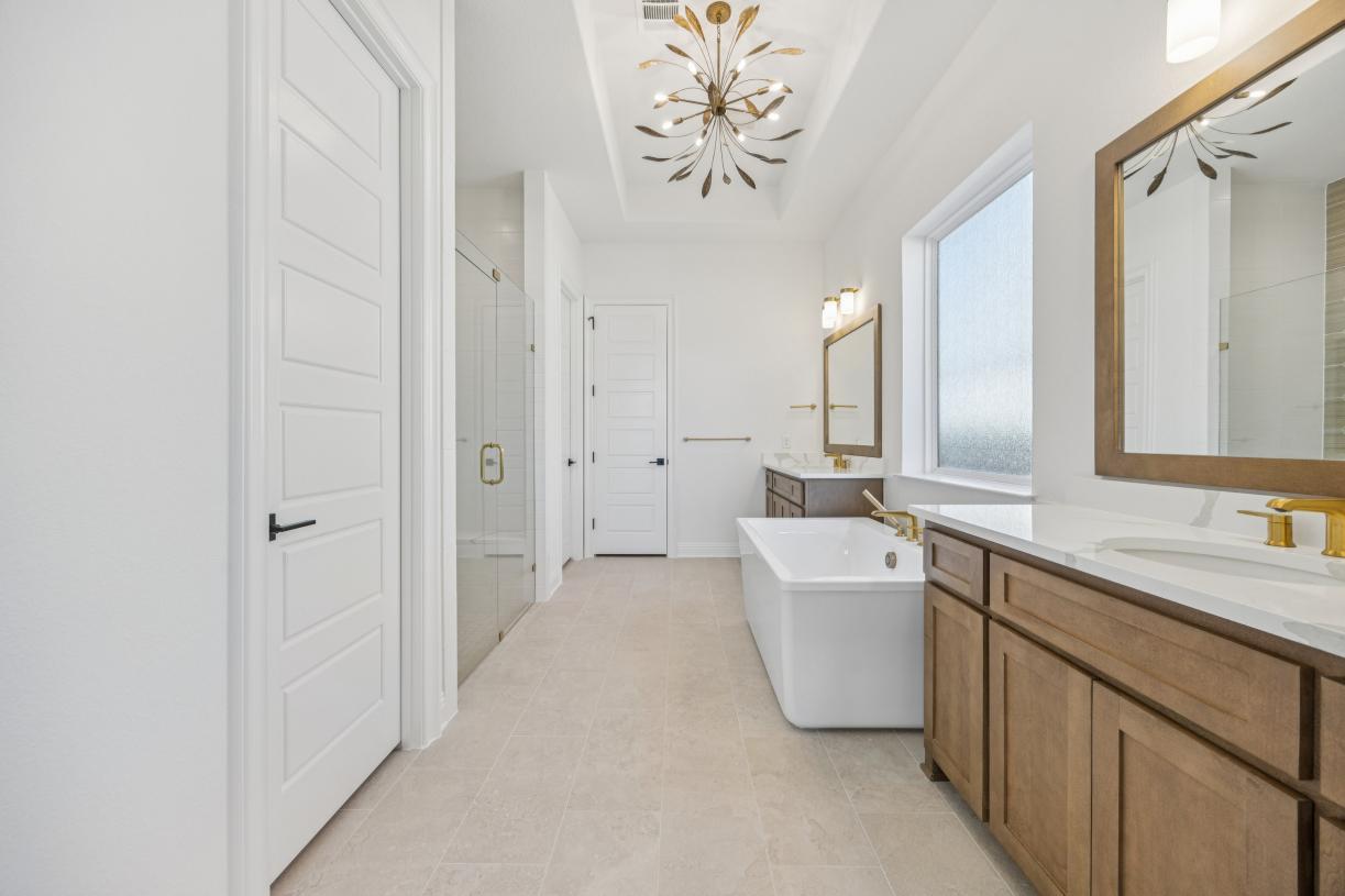 Luxurious primary bath with a large soaking tub