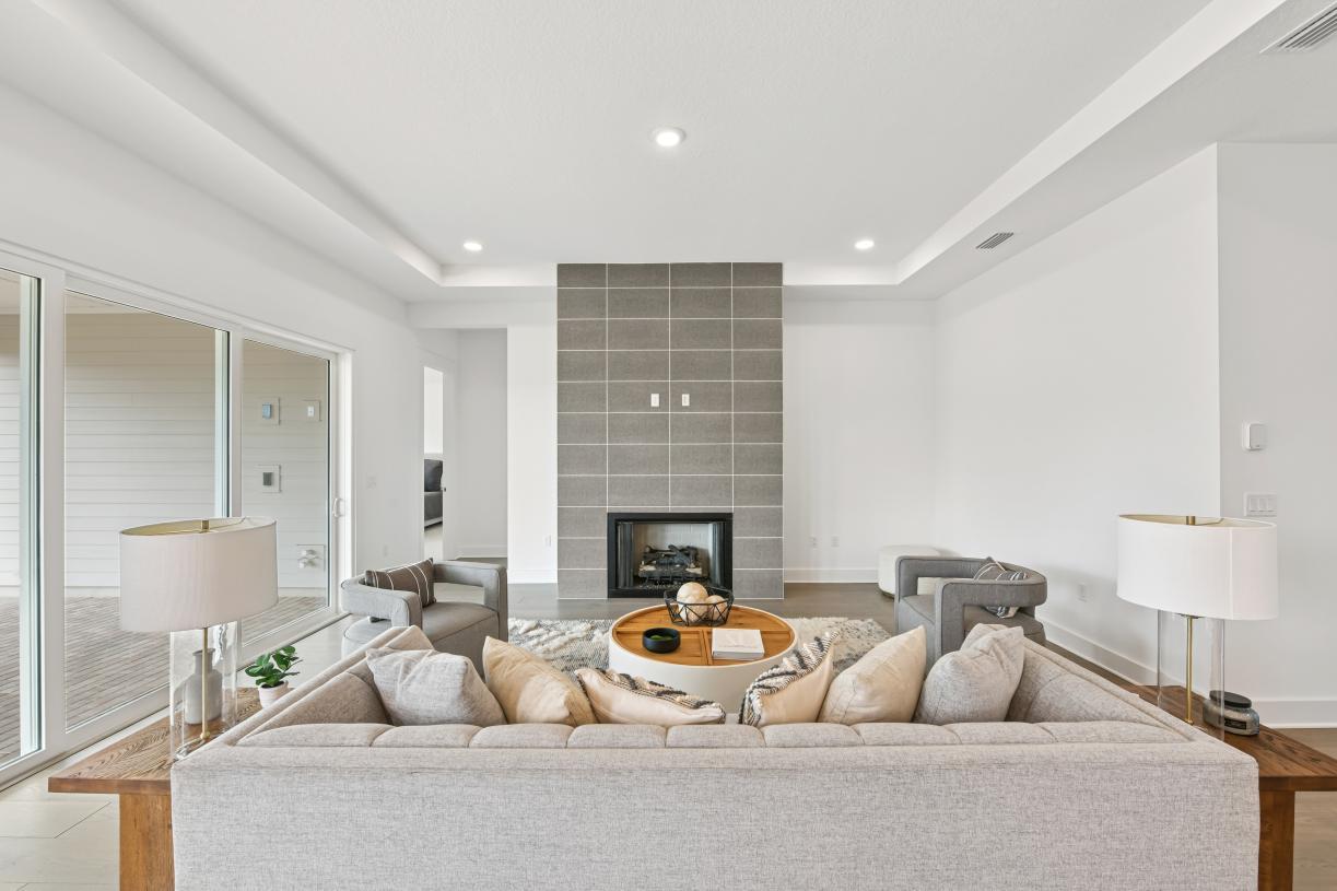 Cozy great room with multi-sliding glass door connecting indoor-outdoor living