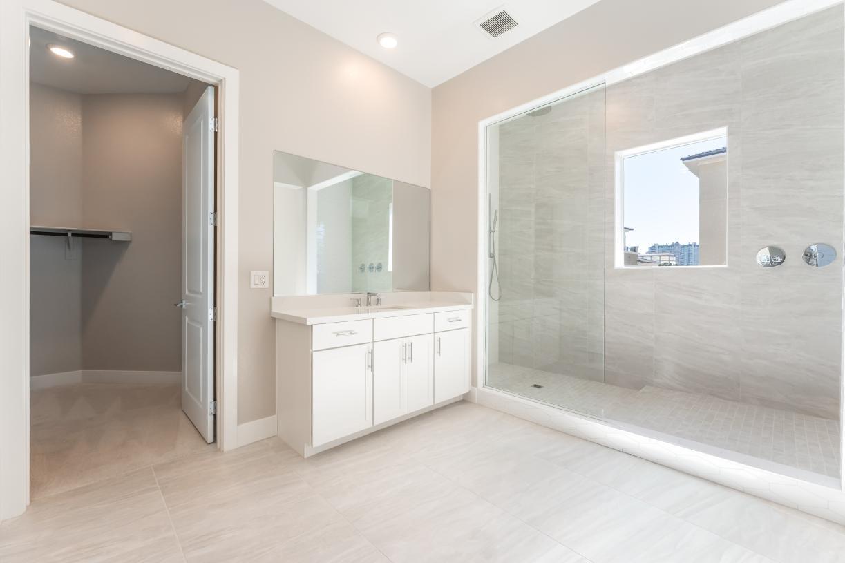 Oversized primary, slab tile surround shower