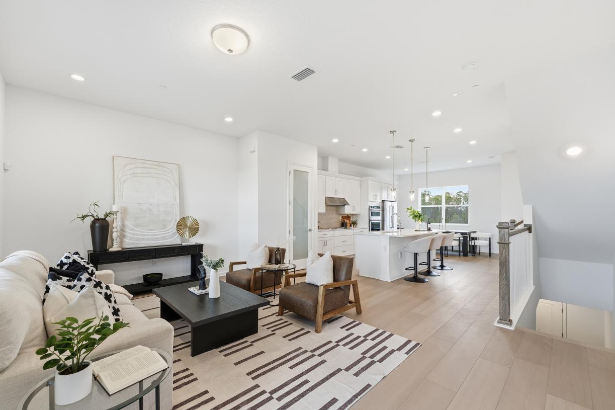 Gather round, entertain, and relax in a grand, light-filled space designed for connection