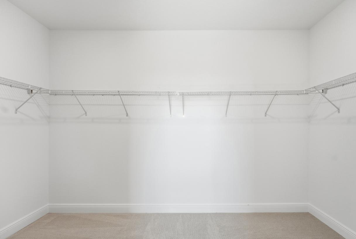 Walk-in closet offers a boutique-style feel with ample room for wardrobe organization