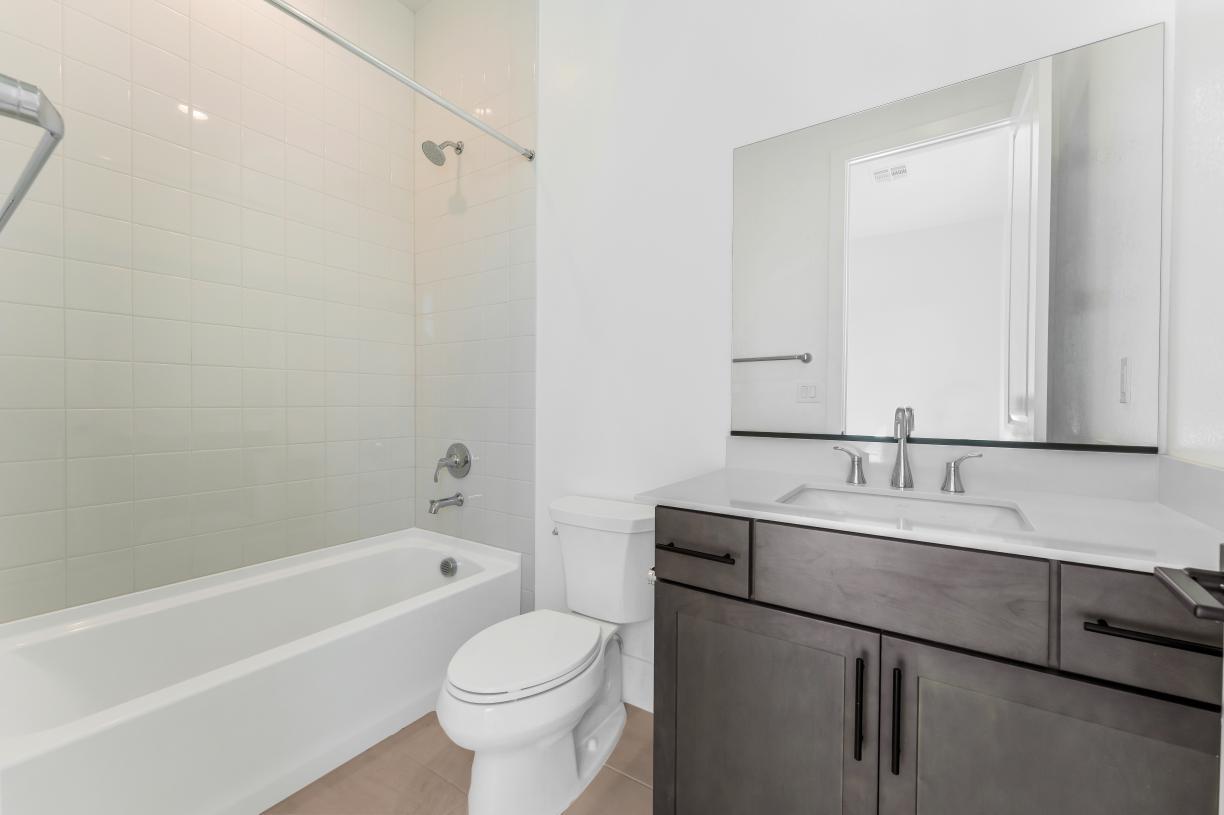 Lovely secondary bath with tile surround