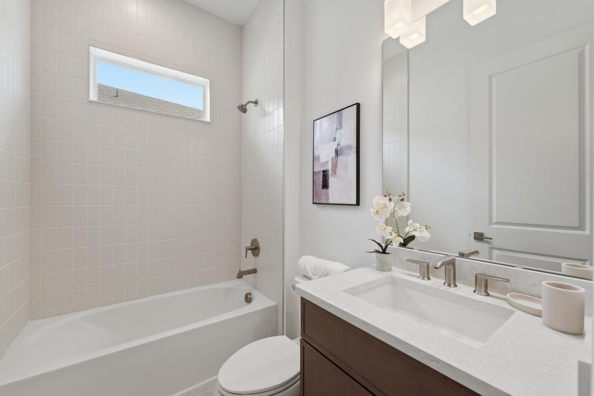 A sleek, modern secondary bathroom