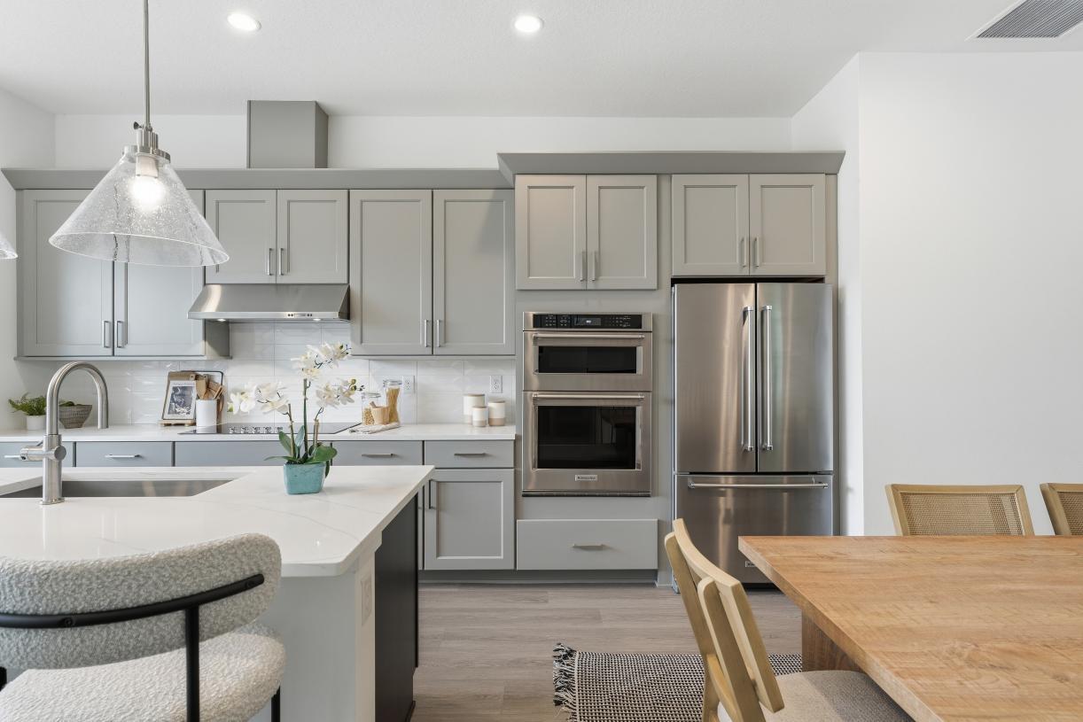Gourmet kitchen boasting a large center island with quartz countertops