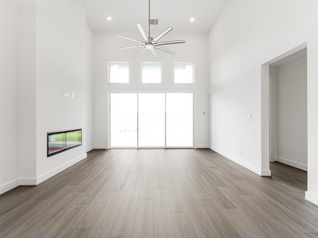 Great room with tall ceilings and a cozy fireplace