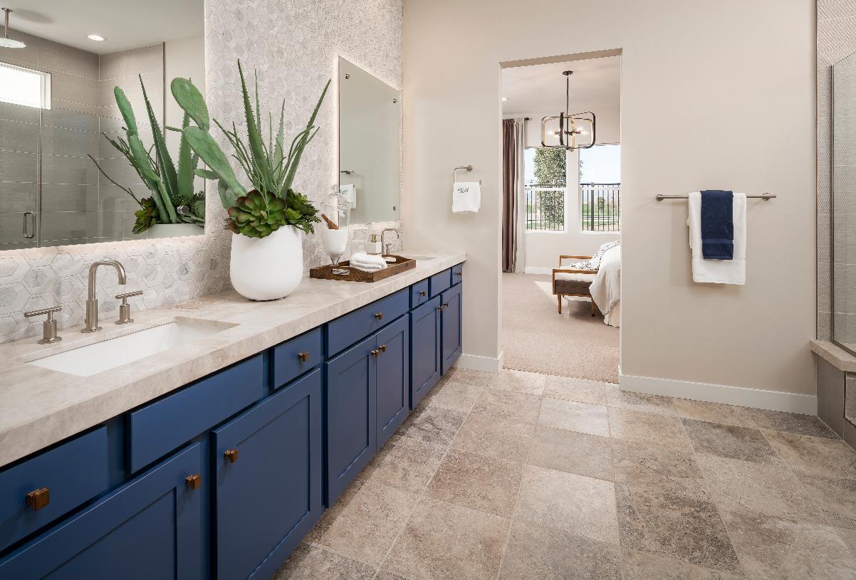 Primary bathroom with walk-in shower and tile floors