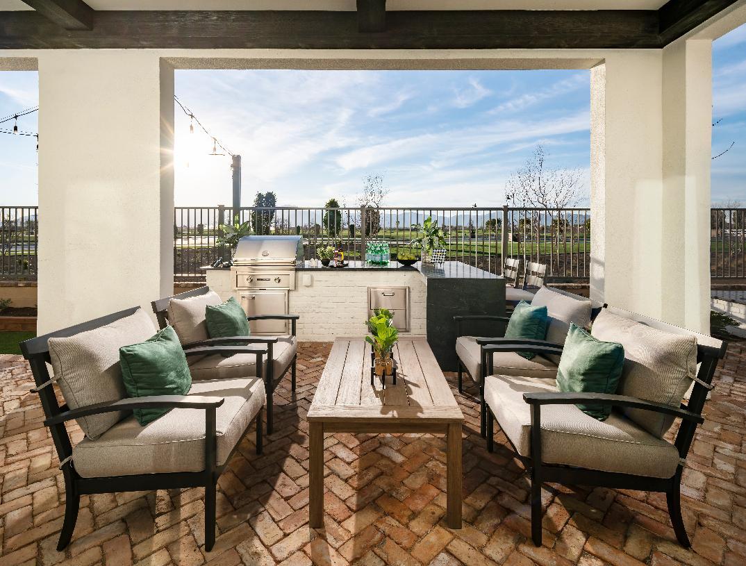 Covered patio with hand hewn beams and built-in BBQ