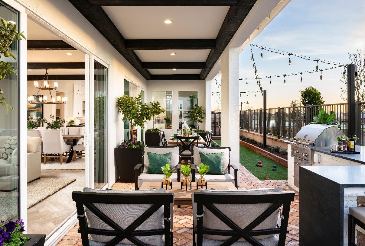 Covered patio with stacking doors and bocce ball court