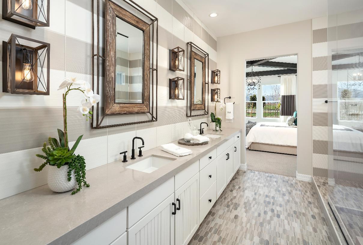Primary bathroom with dual sink vanity and large walk-in shower