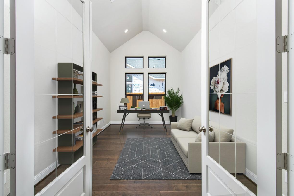 Cathedral ceiling and glass doors in office