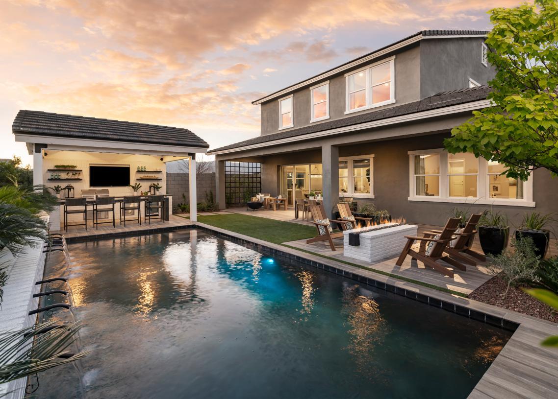 Beautiful resort-style backyard with pool and outdoor kitchen