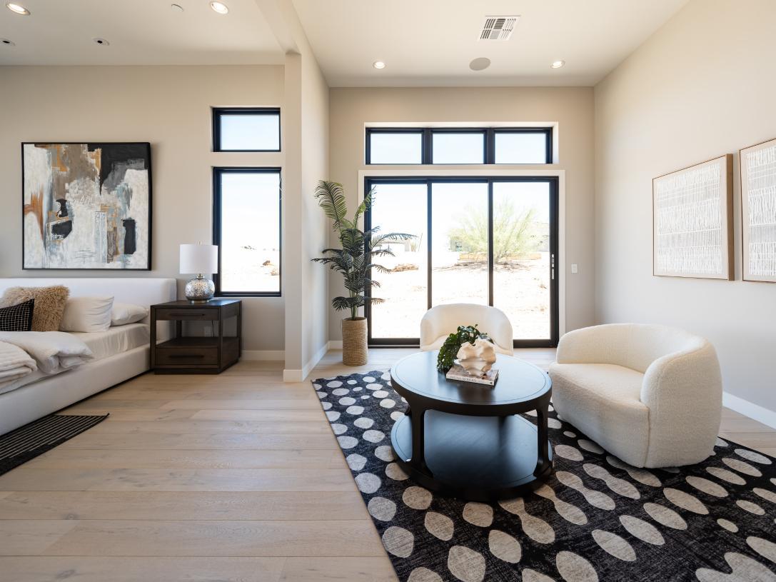 Primary bedroom suite with additional seating area