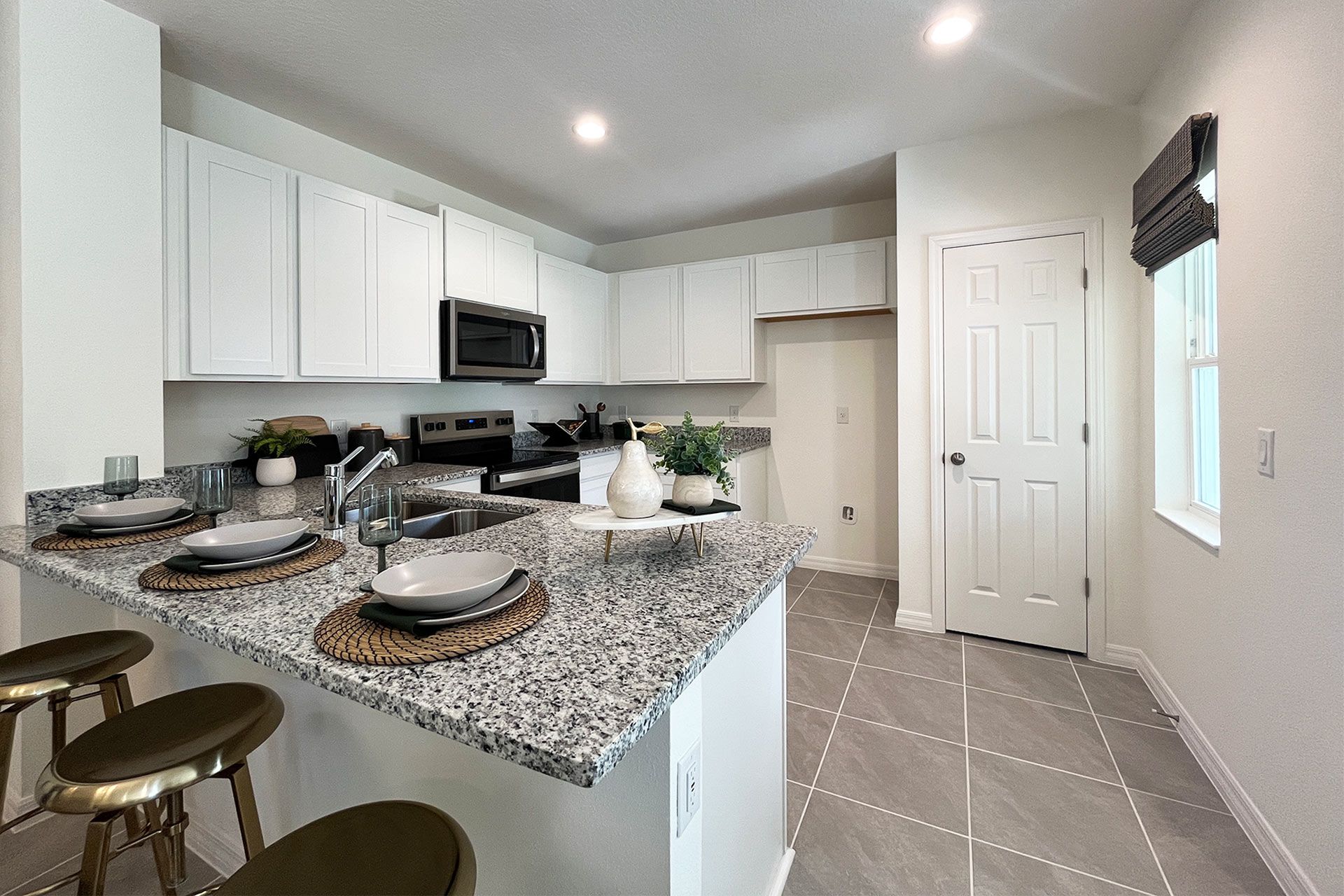 Ashley townhome exterior with covered porch in Pine Meadows, new construction in Eustis FL