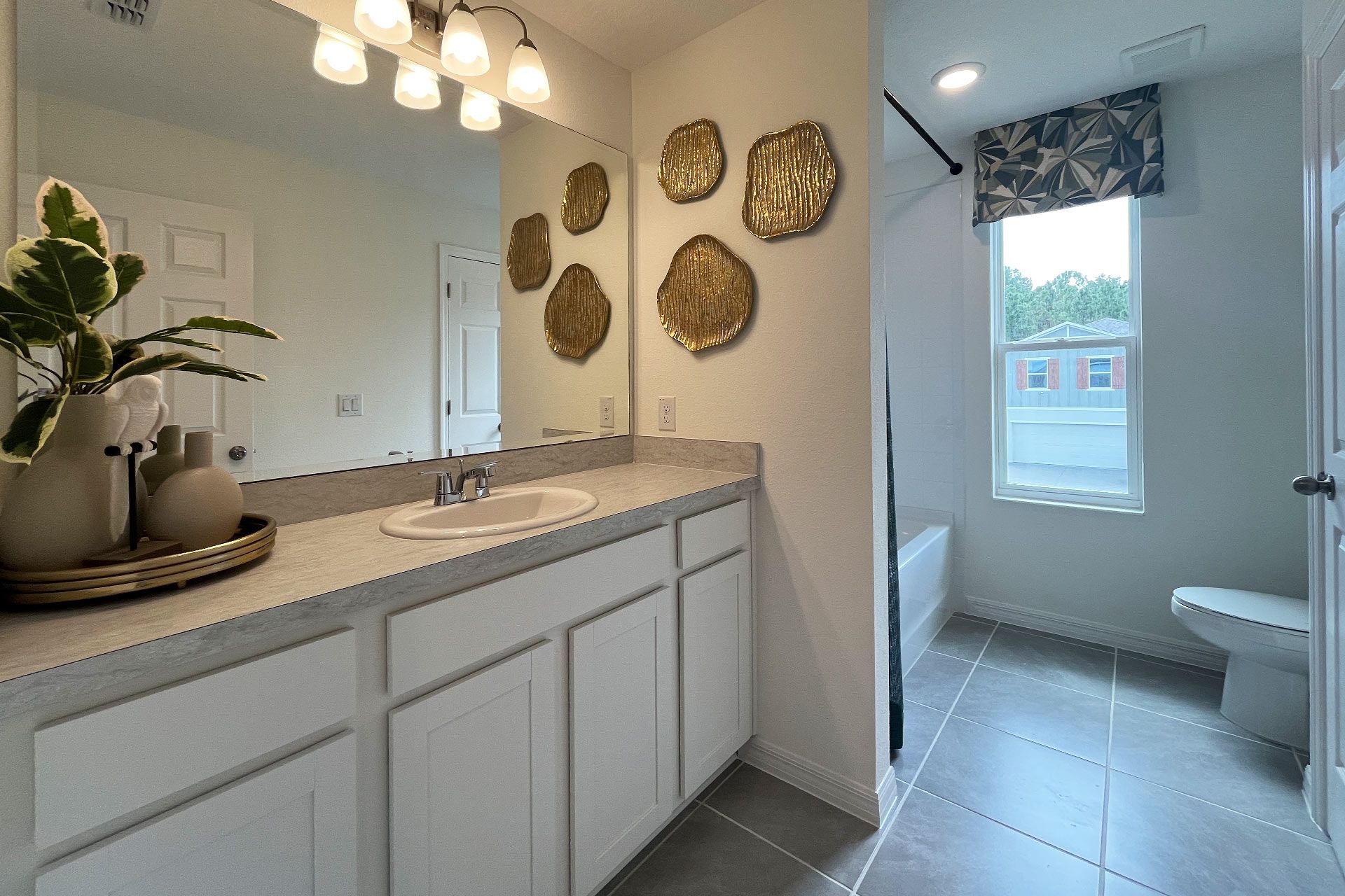 Ashley townhome exterior with covered porch in Pine Meadows, new construction in Eustis FL