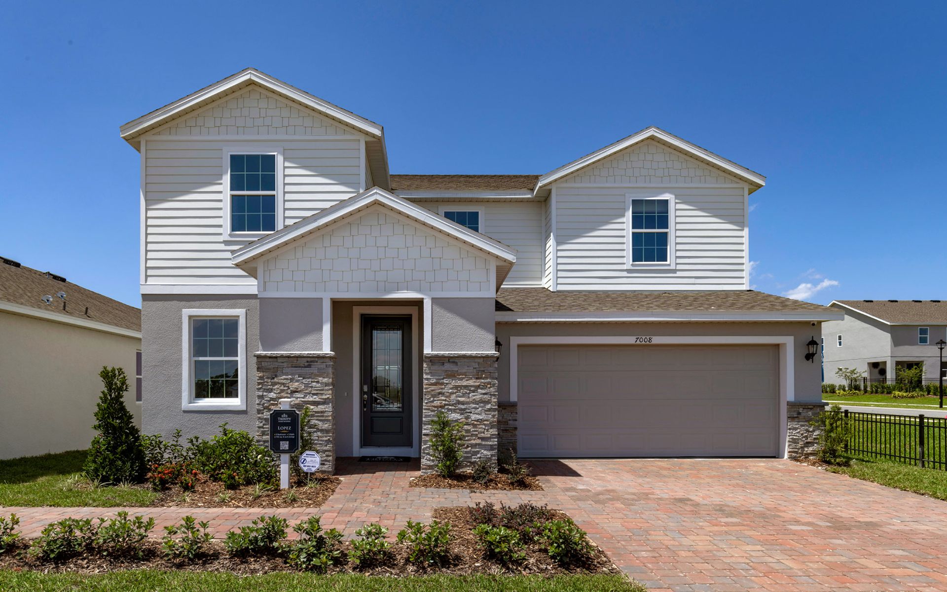 Lopez elevation 3 shown with optional stone (3rd car garage not shown)